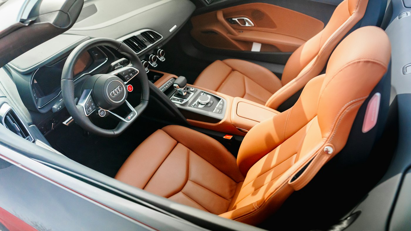 Tan leather seats in a convertible after detailing